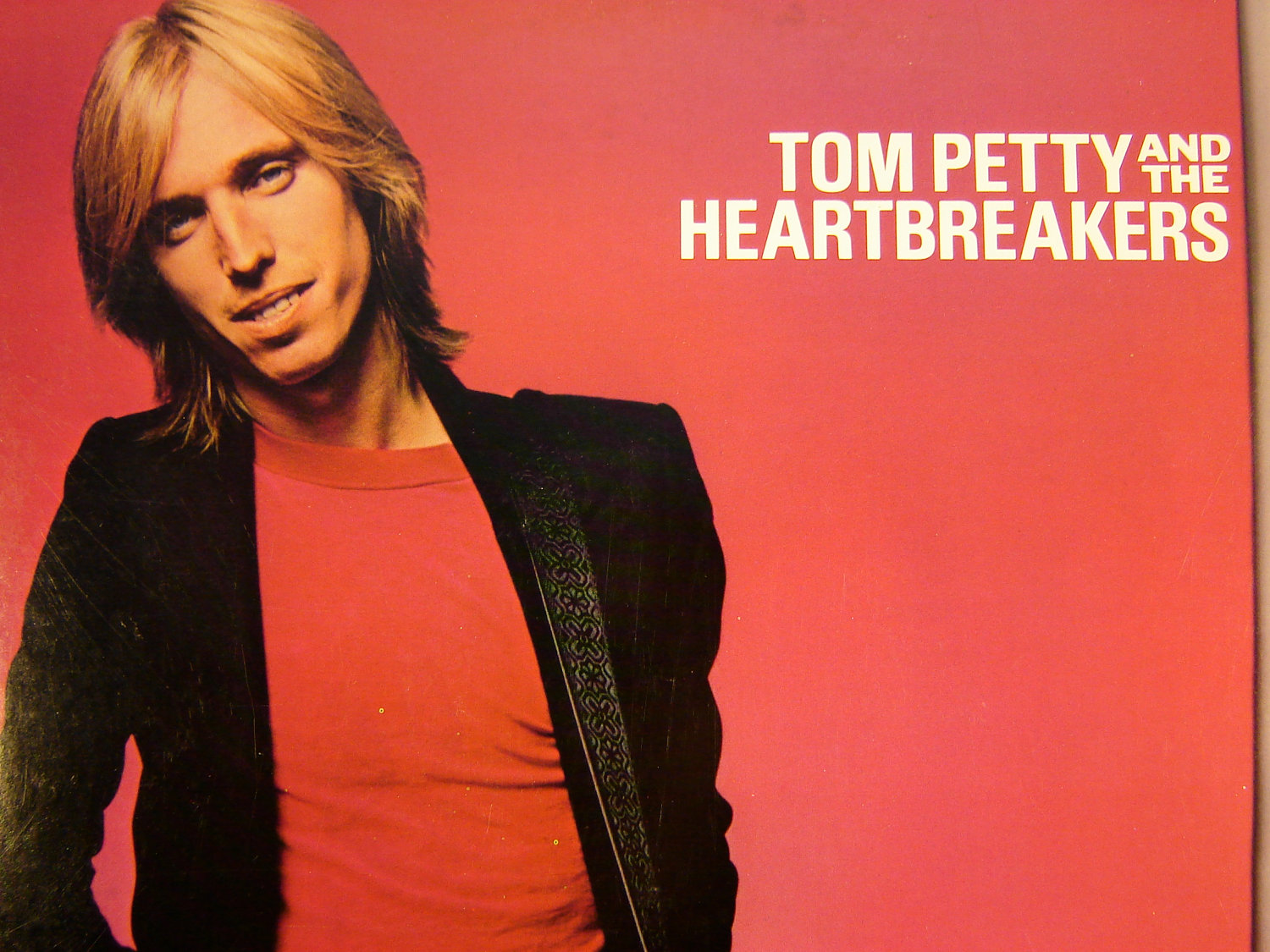 Tom petty love is. Tom Petty and the Heartbreakers. Tom Petty and the Heartbreakers 1976. Том петти в молодости. Tom Petty & the Heartbreakers album 1976.